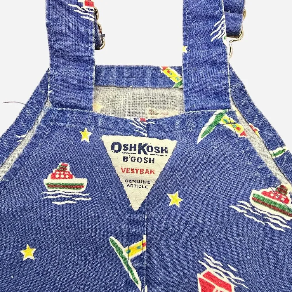 OshKosh B'gosh blue denim overalls with white & red sailboat and star print